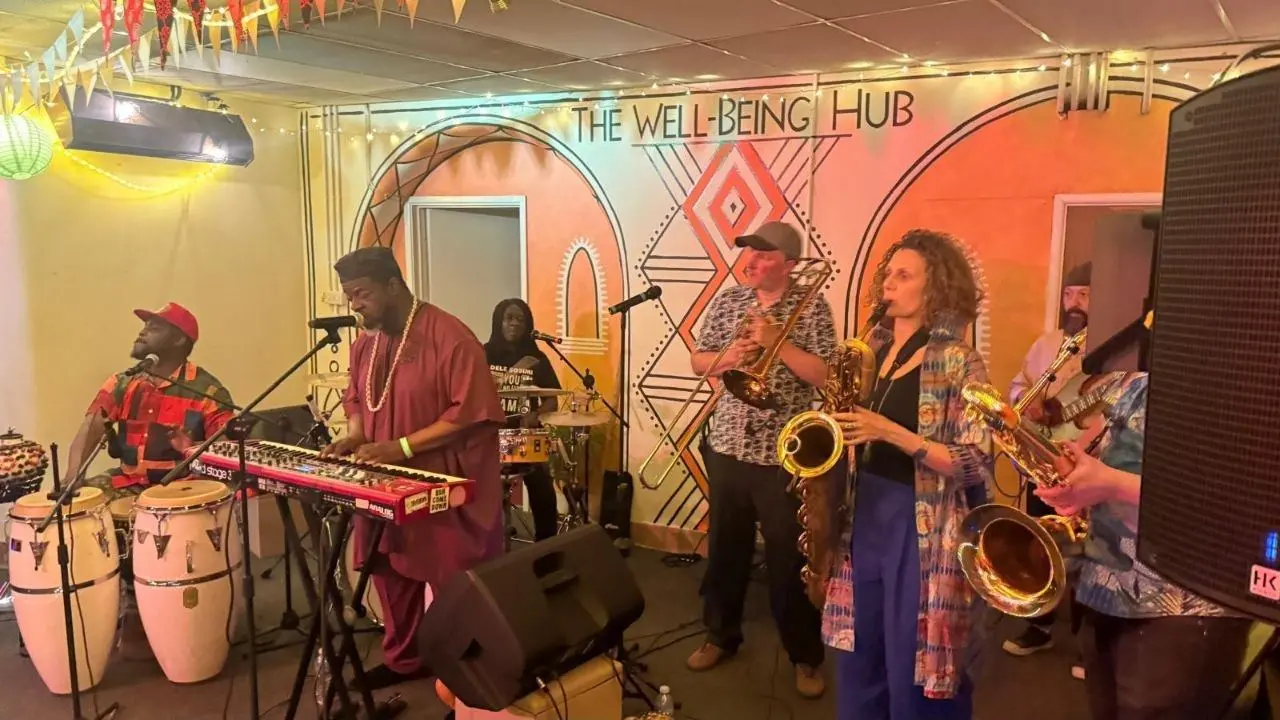 Dele Sosimi performing with his Afrobeat band at The Wellbeing Hub