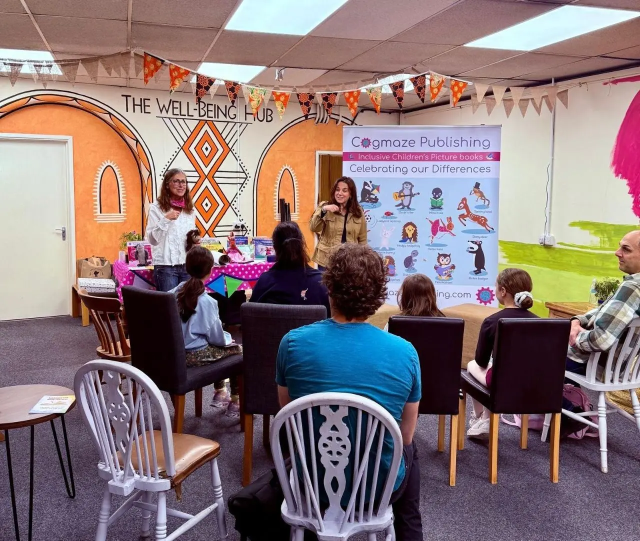 A children's book event with families seated together