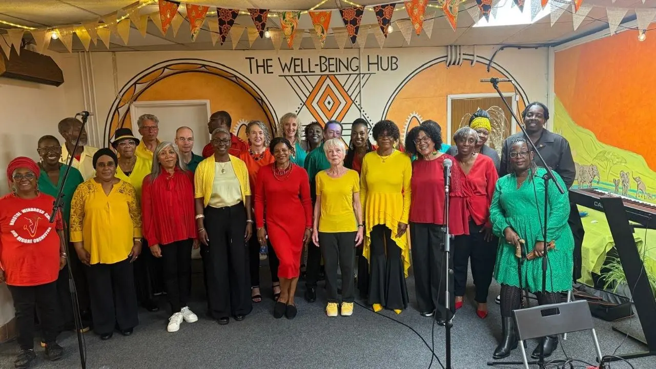 A full choir performing together at The Wellbeing Hub