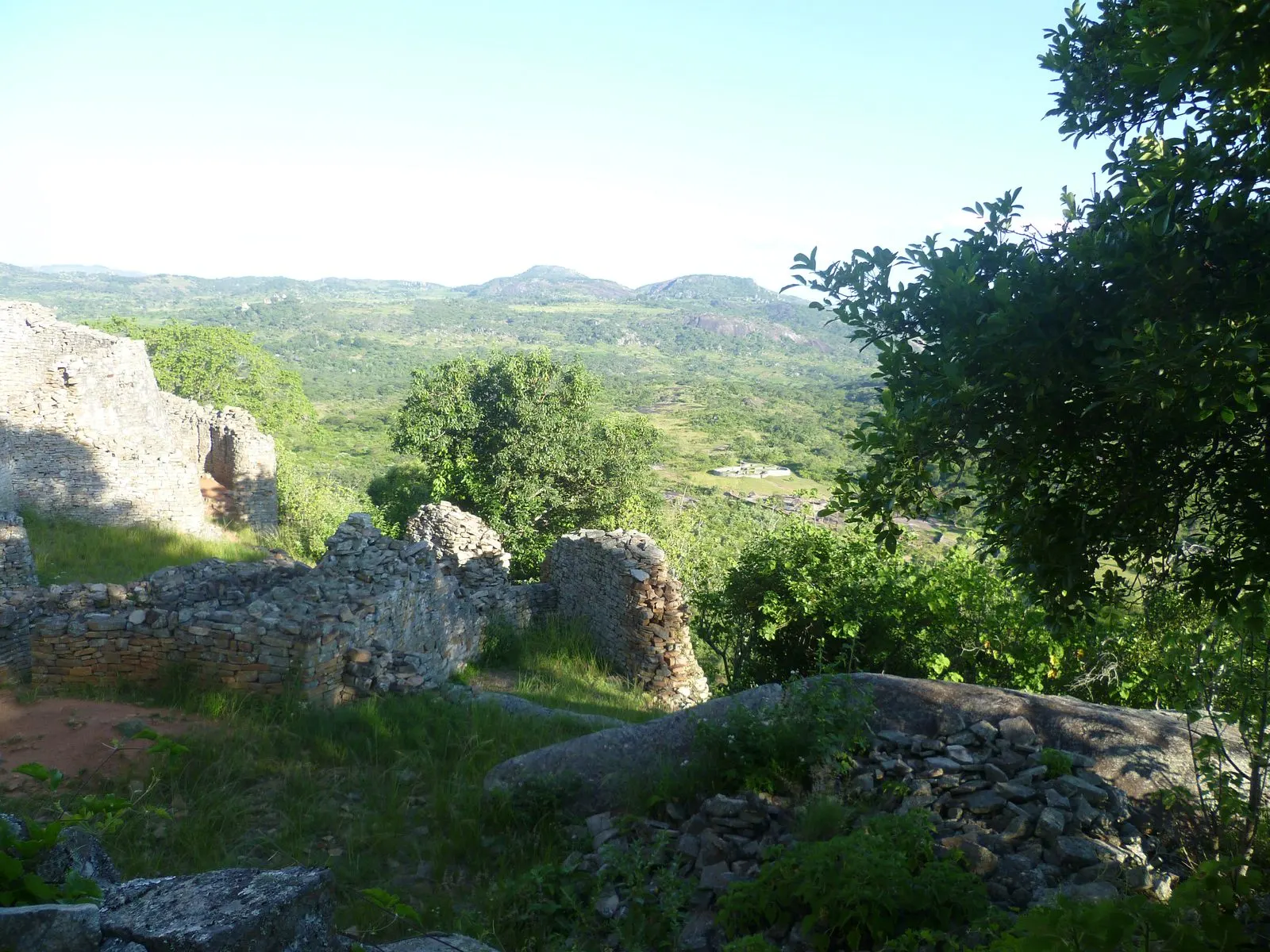 Ancient stone ruins set among rolling green hills in Zimbabwe
