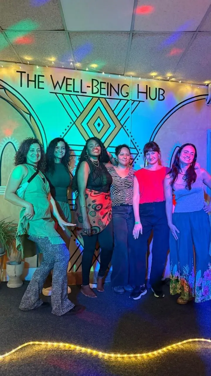Performers together after an evening show at The Wellbeing Hub