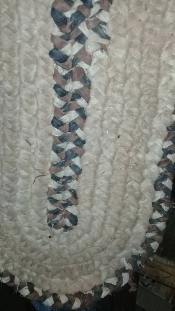 Close view of a woven mat in blue and white fibre